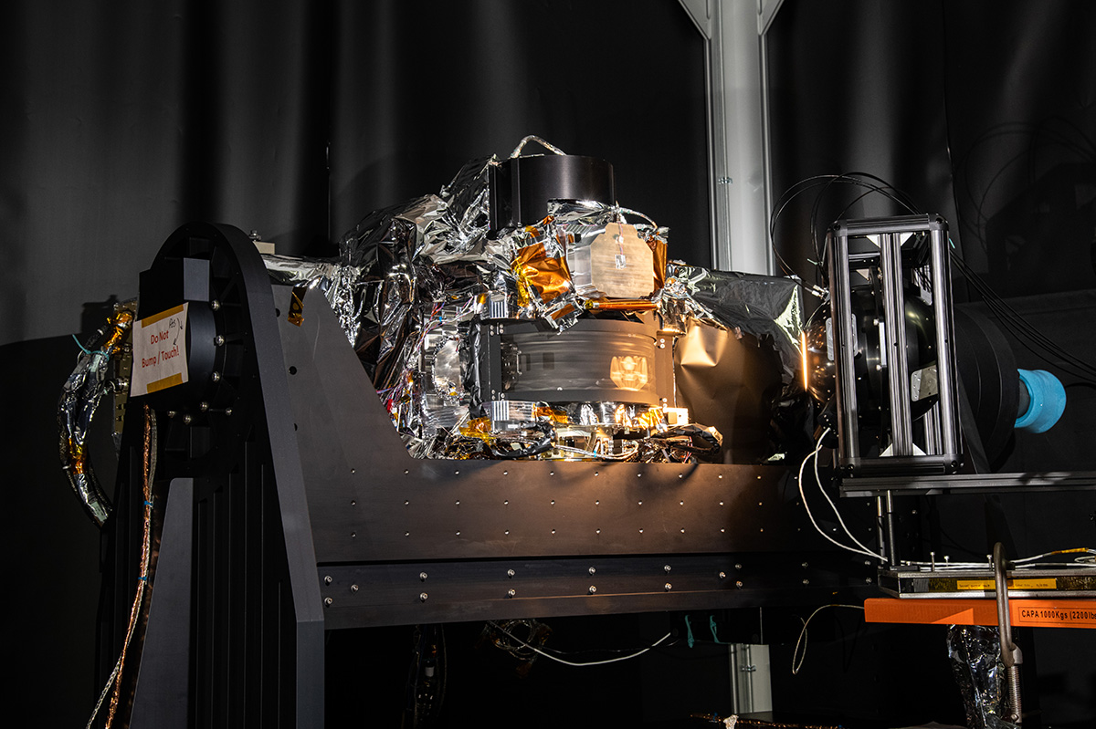 The OCI ETU with the spinning telescope scanning the calibrated light source.
