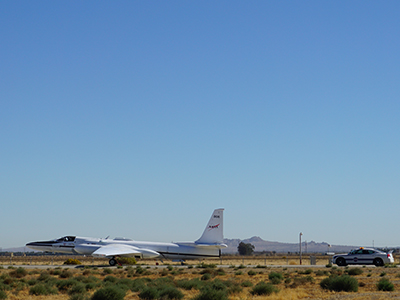 The ER-2 taxis to the runway, followed by its chase car. Credit: Kirk Knobelspiesse (NASA)