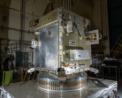 PACE spacecraft structure with mass simulators and tilt platform and solar array strength test fixtures.