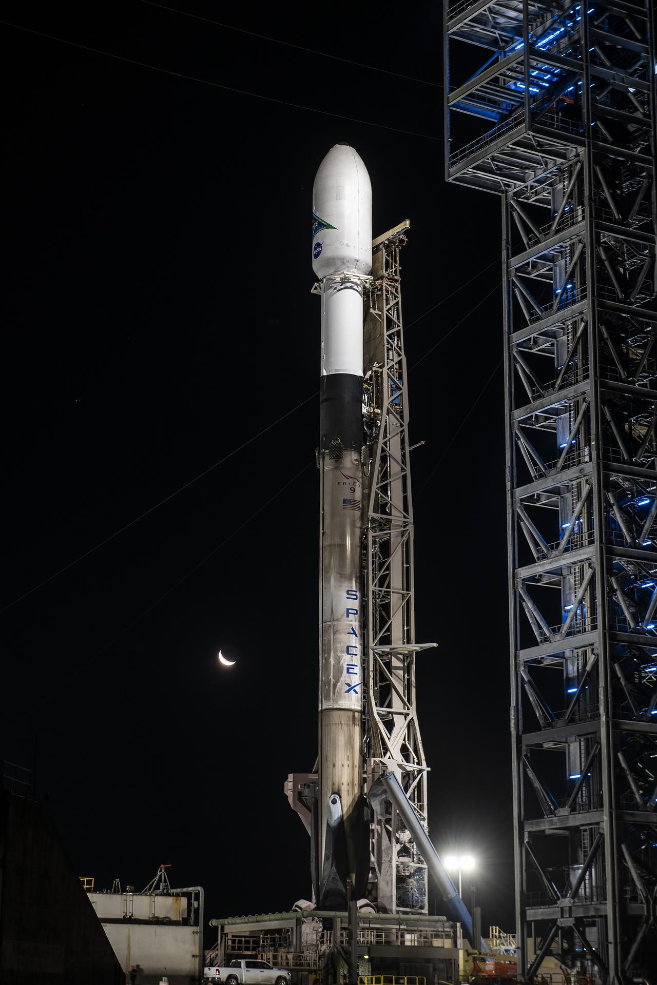 A SpaceX Falcon 9 rocket with NASA's PACE spacecraft encapsulated atop
