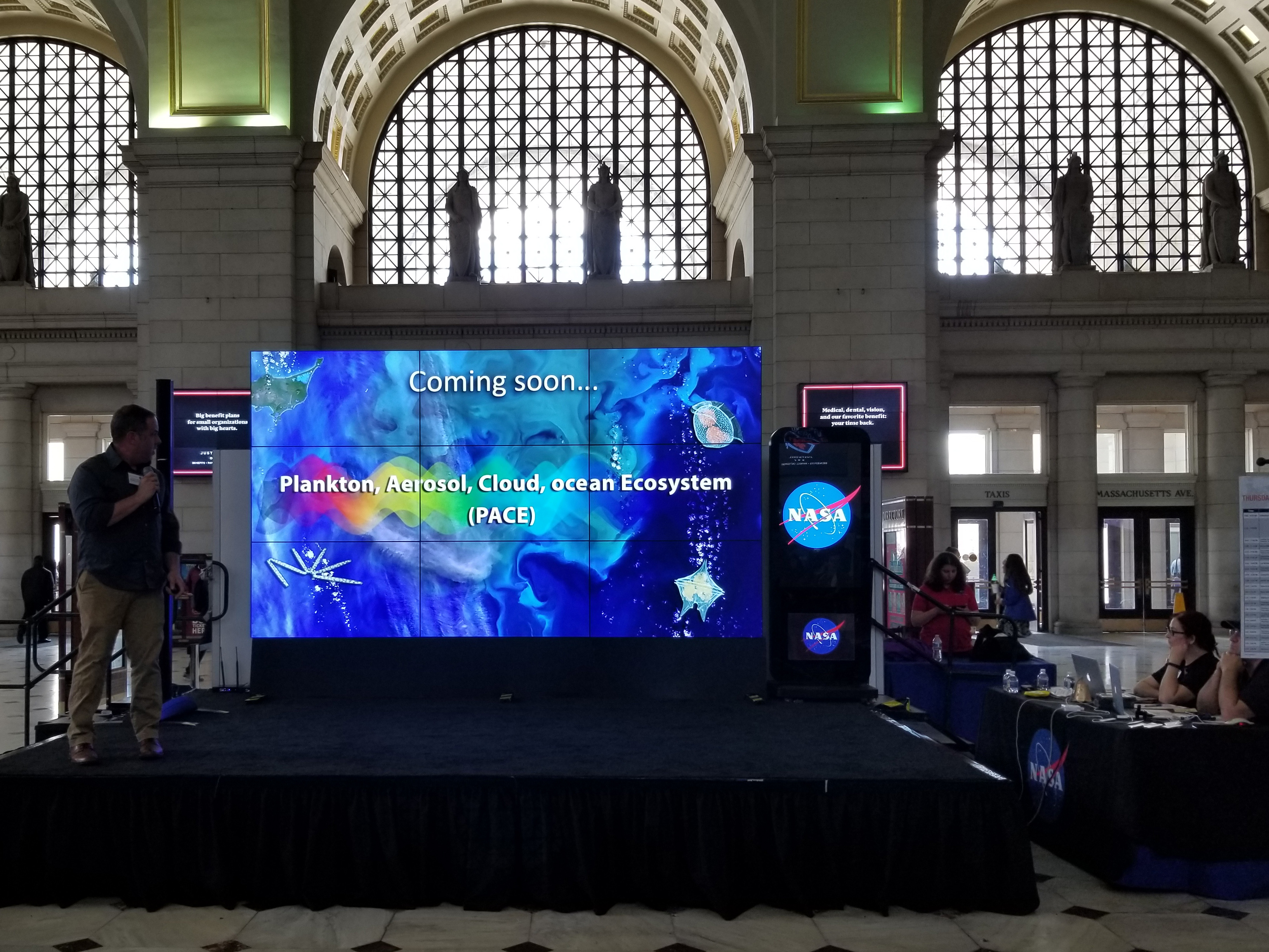 Dr. Jeremy Werdell, PACE Project Scientist, presents a hyperwall talk at the 2018 NASA Earth Day event at Union Station in Washington D.C.