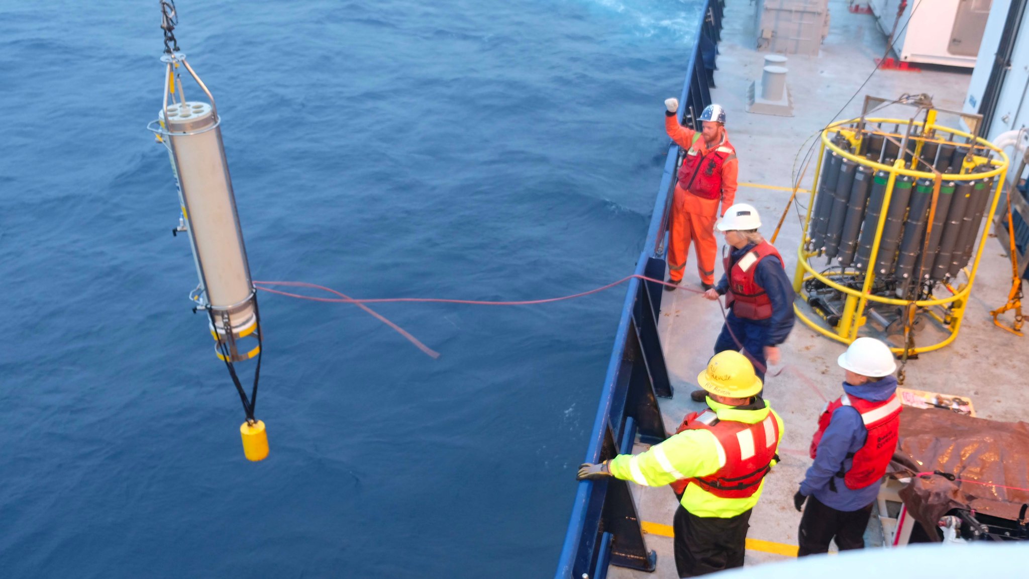 The EXPORTS team deploys a Marine Snow Catcher after several days of rough seas. These instruments sample water from the Twilight Zone - the focus of the cruise - so that scientists can better understand how phytoplankton and zooplankton impact carbon exported to the deep ocean.