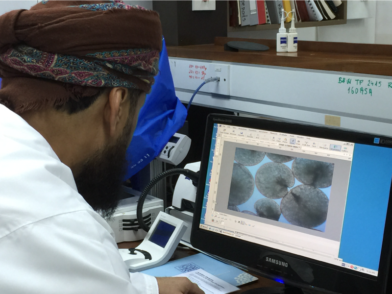 Dr. Khalid Al-Hashmi views an image of microscopic Noctiluca cells